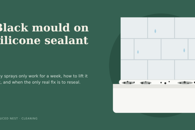 Black mold on silicone sealant along a white bathtub edge